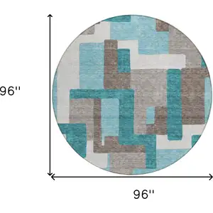 Photo of 8' Teal Blue Aqua And Beige Round Abstract Washable Indoor Outdoor Area Rug