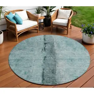 Photo of 8' Teal Blue Aqua And Charcoal Round Abstract Washable Indoor Outdoor Area Rug