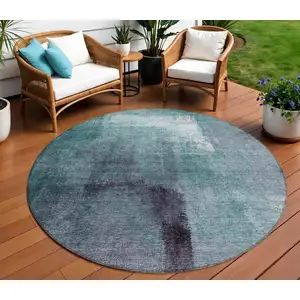 Photo of 8' Teal Blue Aqua And Ivory Round Abstract Washable Indoor Outdoor Area Rug