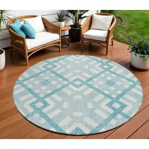 Photo of 8' Teal Blue Aqua And Ivory Round Geometric Washable Indoor Outdoor Area Rug