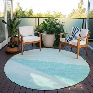 Photo of 8' Teal Blue Aqua And Ivory Round Geometric Washable Indoor Outdoor Area Rug