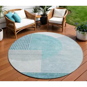 Photo of 8' Teal Blue Blue And Silver Round Geometric Washable Indoor Outdoor Area Rug