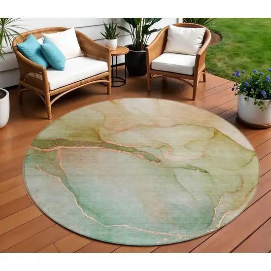 8' Teal Round Abstract Washable Non Skid Area Rug With UV Protection Photo 1