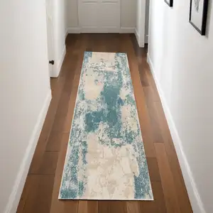 Photo of 8' Teal and Ivory Abstract Non Skid Runner Rug