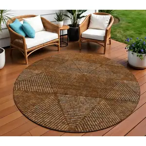 Photo of 8' Terra Cotta Copper And Beige Round Geometric Washable Indoor Outdoor Area Rug