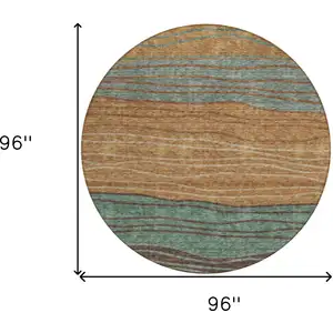 Photo of 8' Terra Cotta Copper And Beige Round Striped Washable Indoor Outdoor Area Rug