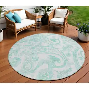 Photo of 8' Turquoise And Ivory Round Paisley Washable Indoor Outdoor Area Rug