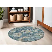 Photo of 5' Turquoise Cream and Navy Blue Floral Distressed Round Rug