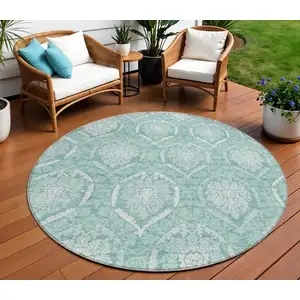 Photo of 8' Turquoise Teal Blue And Ivory Round Medallion Washable Indoor Outdoor Area Rug