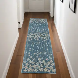 Photo of 7' Turquoise and Cream Botanical Leaves Runner Rug