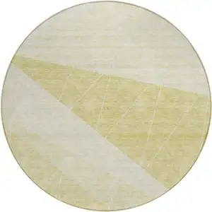 Photo of 8' Wheat Gold And Ivory Round Geometric Washable Indoor Outdoor Area Rug