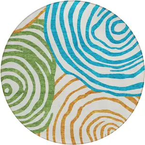 Photo of 8' White Orange And Teal Blue Round Abstract Washable Indoor Outdoor Area Rug