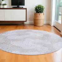 Photo of 5' White Round Abstract Non Skid Area Rug