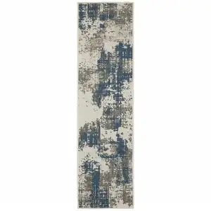 Photo of 2' X 7' Beige Abstract Stain Resistant Indoor Outdoor Area Rug