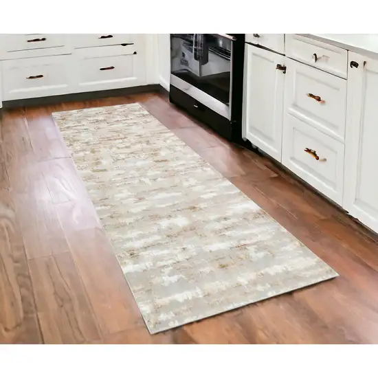 3' X 10' Beige Abstract Washable Non Skid Area Rug Photo 1