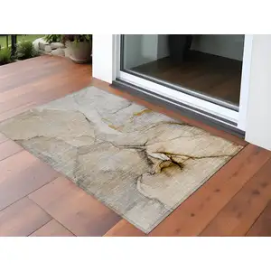 Photo of 3' X 5' Beige Abstract Washable Non Skid Indoor Outdoor Area Rug