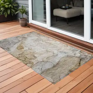 Photo of 3' X 4' Beige Abstract Washable Non Skid Indoor Outdoor Area Rug