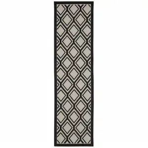 Photo of 2' X 7' Beige Geometric Stain Resistant Indoor Outdoor Area Rug