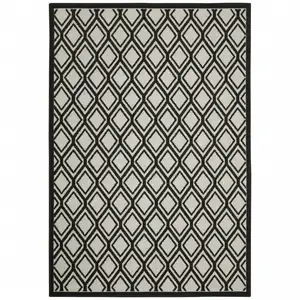 Photo of 6' X 9' Beige Geometric Stain Resistant Indoor Outdoor Area Rug