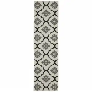 Photo of 2' X 7' Beige Geometric Stain Resistant Indoor Outdoor Area Rug