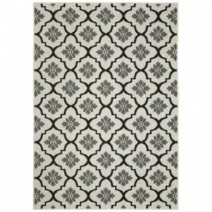 Photo of 6' X 9' Beige Geometric Stain Resistant Indoor Outdoor Area Rug