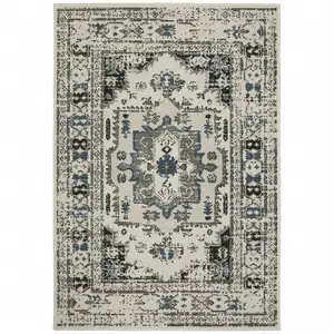 Photo of 6' X 9' Beige Oriental Stain Resistant Indoor Outdoor Area Rug