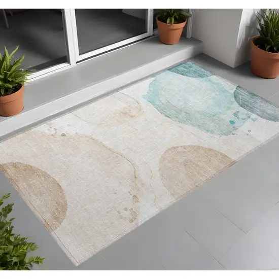 3' X 5' Beige and Blue Abstract Washable Non Skid Indoor Outdoor Area Rug Photo 1