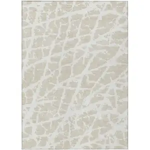 Photo of 3' X 5' Beige and Ivory Abstract Washable Non Skid Indoor Outdoor Area Rug