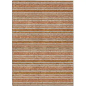 Photo of 3' X 5' Beige and Orange Striped Washable Non Skid Indoor Outdoor Area Rug