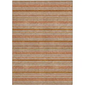 Photo of 3' X 5' Beige and Orange Striped Washable Non Skid Indoor Outdoor Area Rug