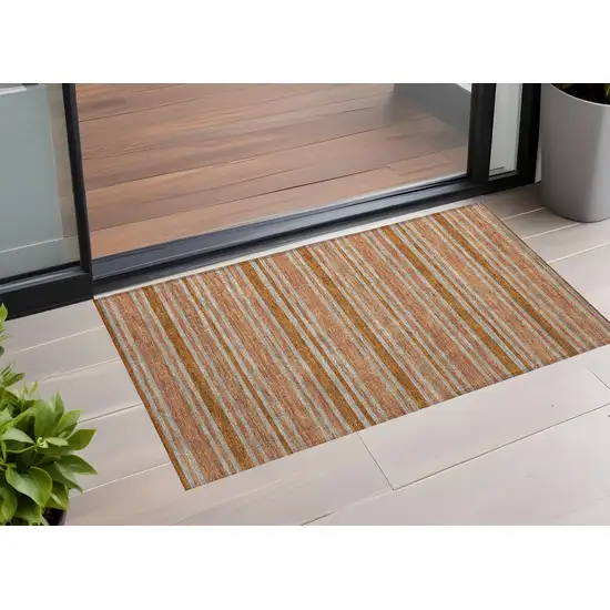 3' X 5' Beige and Orange Striped Washable Non Skid Indoor Outdoor Area Rug Photo 1