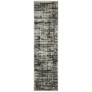 Photo of 2' X 7' Black Abstract Stain Resistant Indoor Outdoor Area Rug