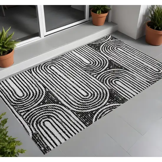 3' X 4' Black and White Abstract Washable Non Skid Indoor Outdoor Area Rug Photo 1