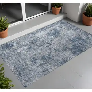 Photo of 3' X 4' Blue Abstract Washable Non Skid Indoor Outdoor Area Rug