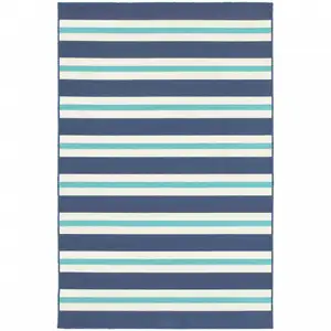 Photo of 6' X 9' Blue Geometric Stain Resistant Indoor Outdoor Area Rug