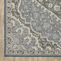 Photo of 6' X 9' Blue Oriental Stain Resistant Indoor Outdoor Area Rug