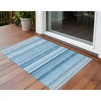 Photo of 3' X 5' Blue Striped Washable Non Skid Indoor Outdoor Area Rug