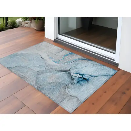 3' X 4' Blue and Ivory Abstract Washable Non Skid Indoor Outdoor Area Rug Photo 1