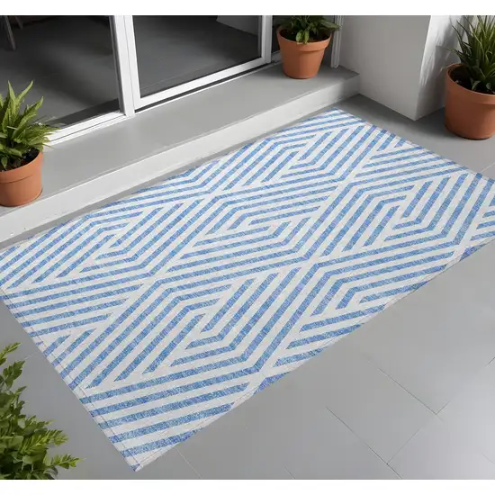 3' X 4' Blue and Ivory Geometric Washable Non Skid Indoor Outdoor Area Rug Photo 1