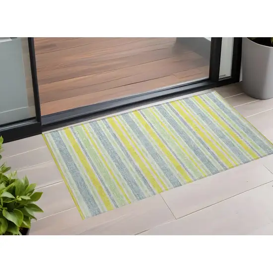 3' X 5' Blue and Yellow Striped Washable Non Skid Indoor Outdoor Area Rug Photo 1