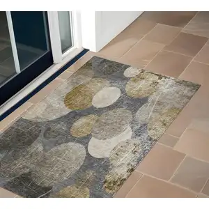 Photo of 3' X 5' Brown Beige and Ivory Abstract Washable Non Skid Indoor Outdoor Area Rug