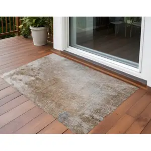 Photo of 3' X 4' Brown and Off White Abstract Washable Non Skid Indoor Outdoor Area Rug