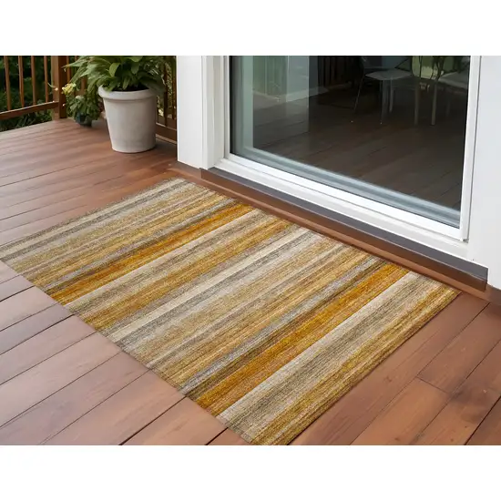 3' X 4' Brown and Orange Striped Washable Non Skid Indoor Outdoor Area Rug Photo 1