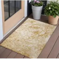 Photo of 3' X 5' Cream and Gold Abstract Washable Non Skid Indoor Outdoor Area Rug