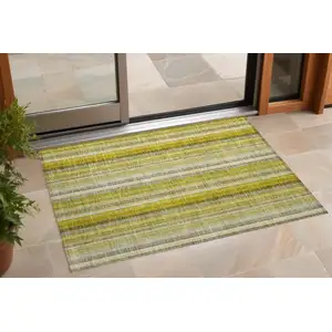 Photo of 3' X 5' Gold Striped Washable Non Skid Indoor Outdoor Area Rug