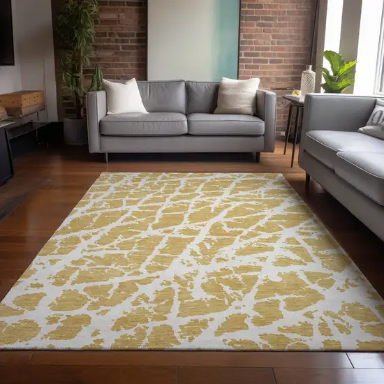 3' X 5' Gold and White Abstract Washable Non Skid Indoor Outdoor Area Rug Photo 9