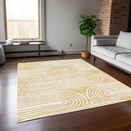 3' X 4' Gold and White Abstract Washable Non Skid Indoor Outdoor Area Rug Photo 9