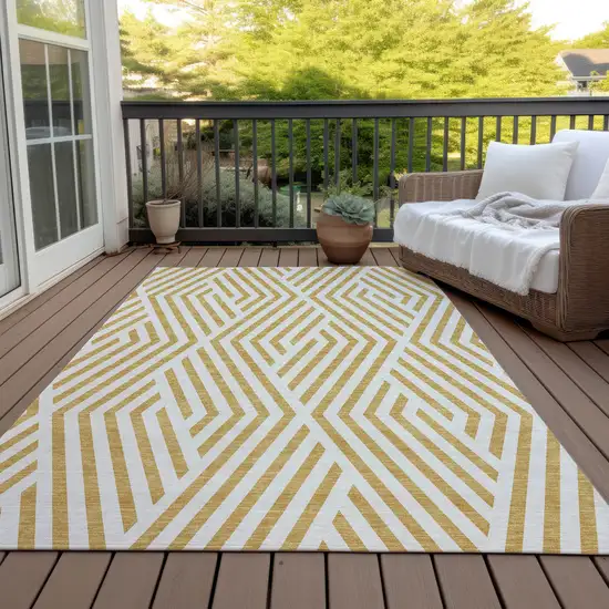 3' X 4' Gold and White Geometric Washable Non Skid Indoor Outdoor Area Rug Photo 8