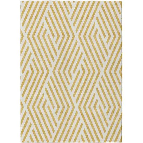 3' X 4' Gold and White Geometric Washable Non Skid Indoor Outdoor Area Rug Photo 1