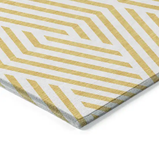 3' X 5' Gold and White Geometric Washable Non Skid Indoor Outdoor Area Rug Photo 7